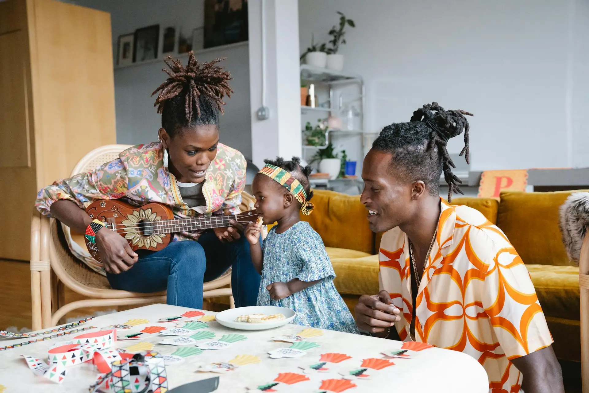Joyful family playing music and games in a cozy home setting, showcasing love and creativity.